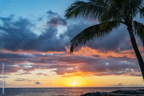 The sun sets at a beach on Oahu, Hawaii