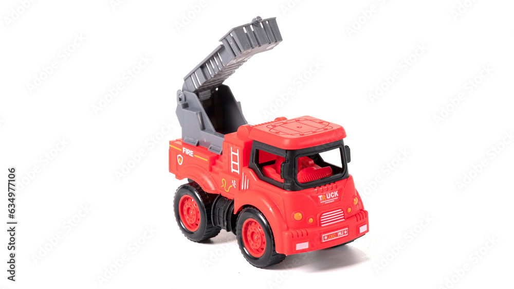 Plastic model fire brigade car isolated on white background.