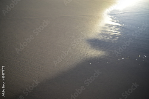 where the water meets the dry sand on the beach