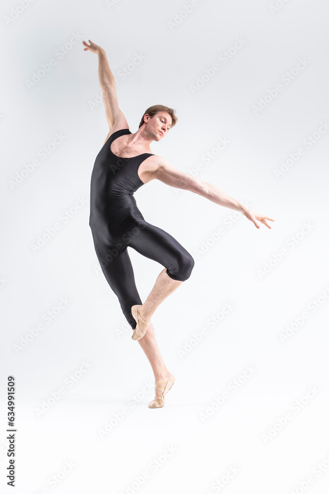 Modern Ballet Dancing. Contemporary Art Ballet of Young Caucasian Athletic Man in Black Suit Dancing in Studio