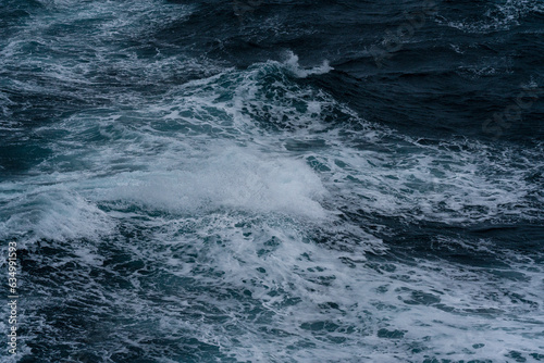 Sea surface. Blue water texture. Close up blue water surface at deep ocean