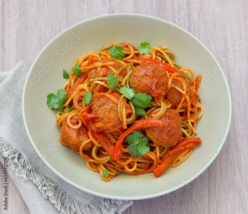 Tricolour spaghetti with vegetables and beef meatballs