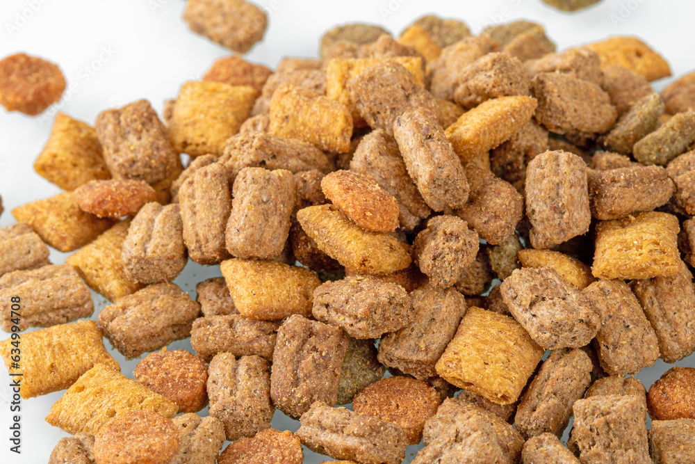 Heap of colorful dry cat food isolated on white background Heap of colorful dry cat food isolated on white background