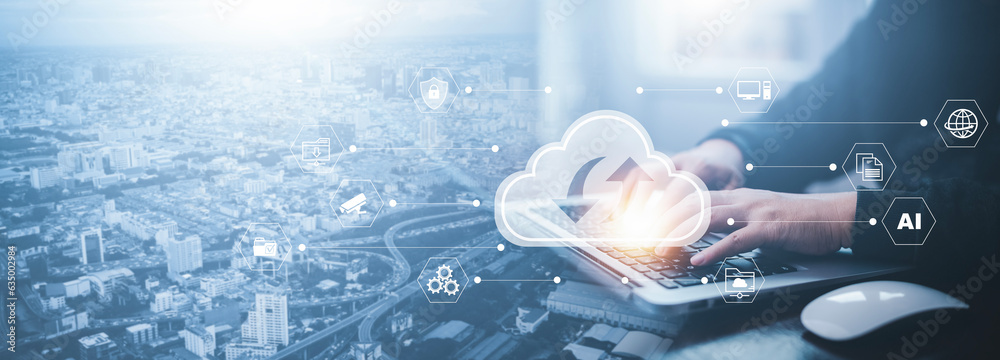 Businessman hand holding smartphone and laptop with cloud computing ...
