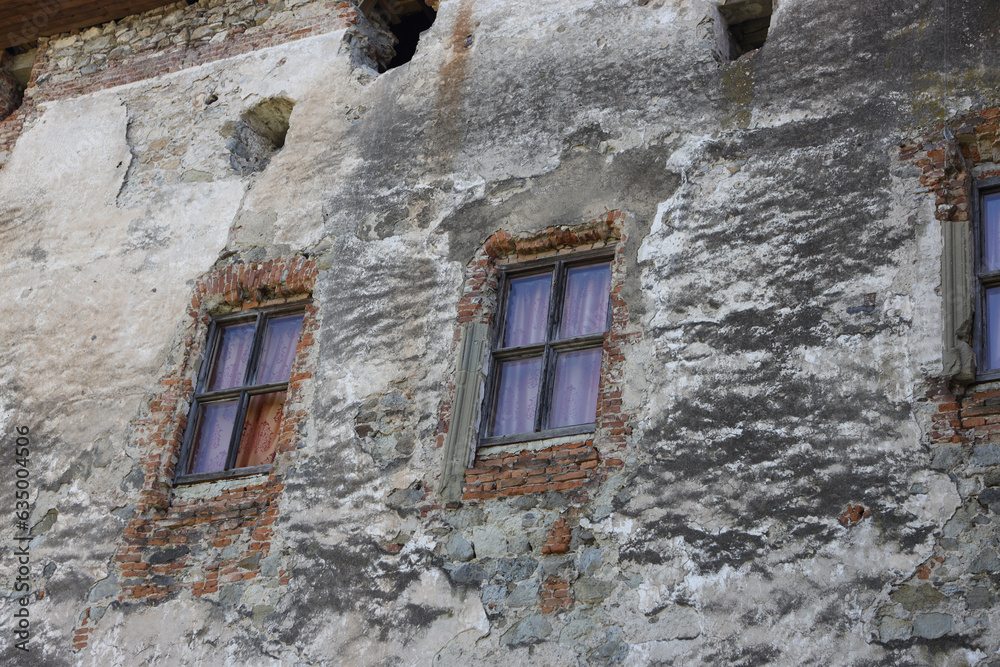 exclusive texture of an ancient castle wall with windows
