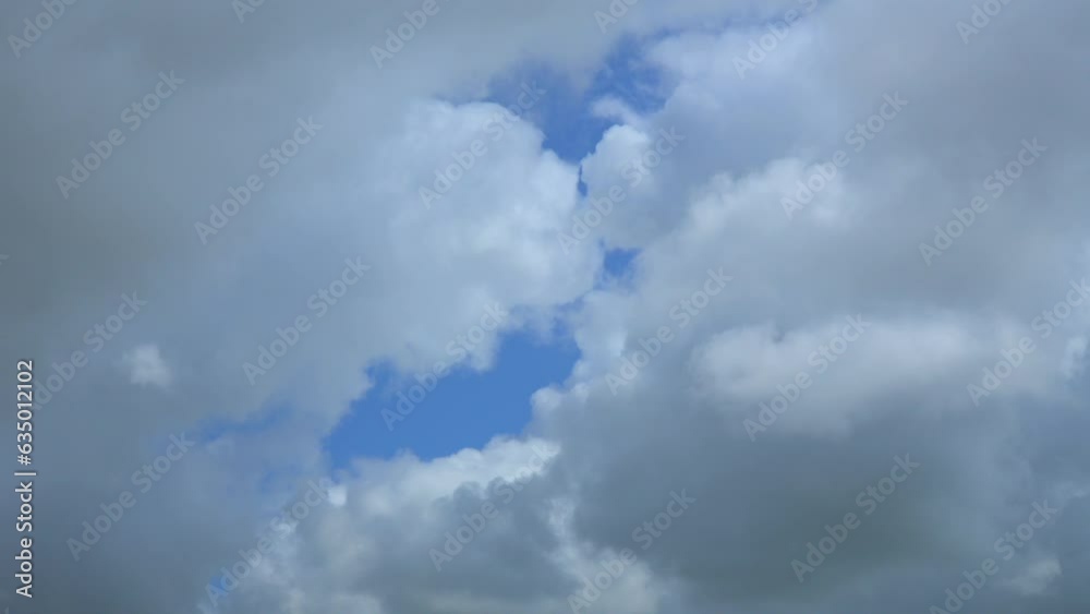 Cumulonimbus clouds gathering and blotting out blue sky. Time lapse 30x. Cumulonimbus clouds gathering and blotting out blue sky. Time lapse 30x.