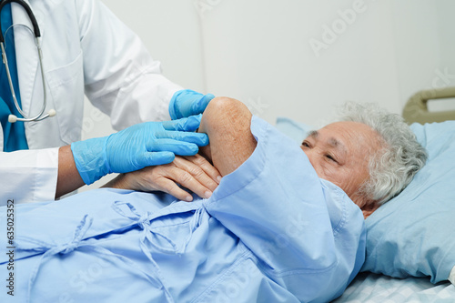 Doctor taking care, help and encourage Asian elder senior woman patient in clinic hospital.