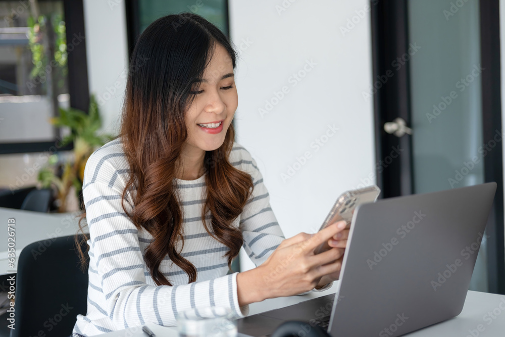 Young woman engaged in online study or project work with smartphone. Young woman engaged in online study or project work with smartphone.
