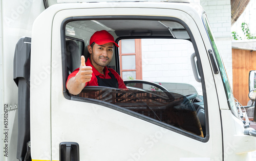Professional services logistic moving house team concept, Indian or Latin driver and Caucasian worker in uniform thums up for good services sitting in cargo truck, plan deliver furniture to new house