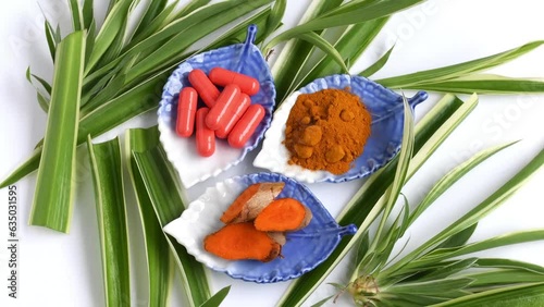 Turmeric root and turmeric powder with powder in capsule for alternative medicine ,spa products and food ingredient.