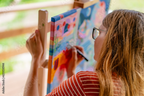 Artist woman with a painting