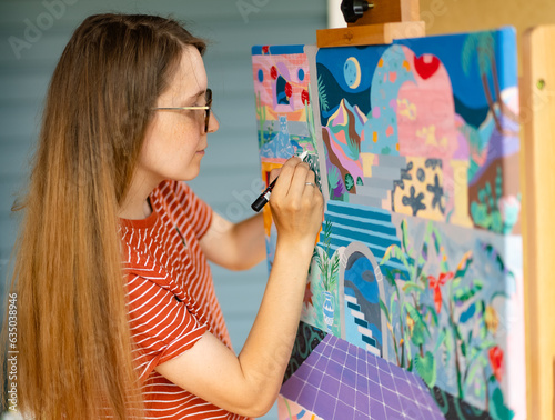 Artist woman with a painting