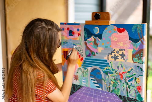 Artist woman with a painting