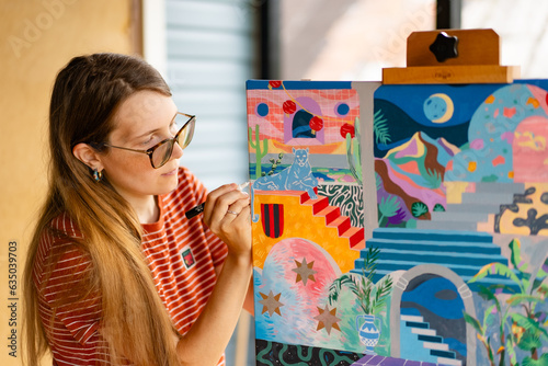 Artist woman with a painting