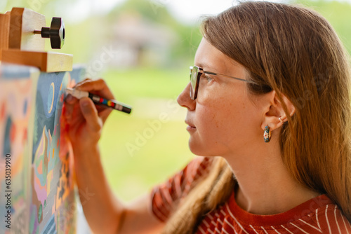 Artist woman with a painting