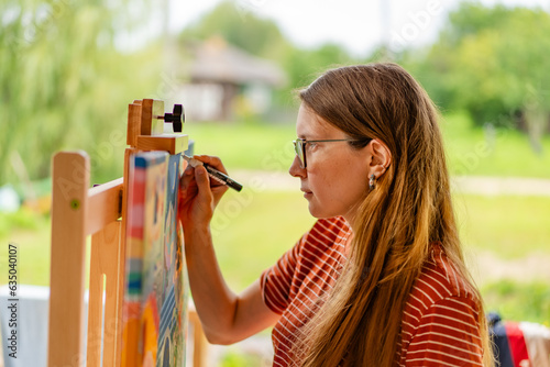 Artist woman with a painting