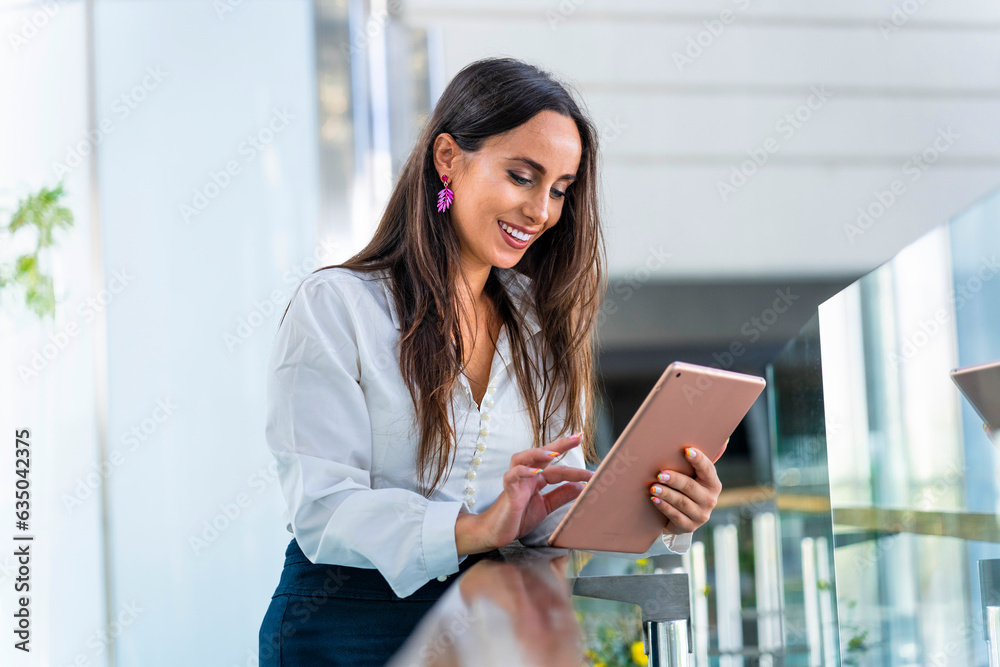 Business woman working with a tablet in a modern office Business woman working with a tablet in a modern office