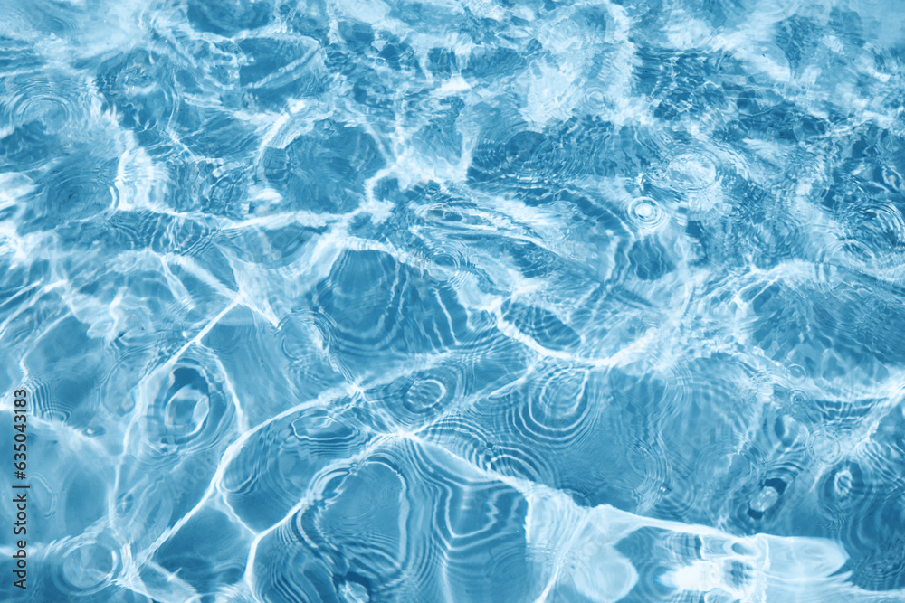 Naklejka premium Abstract water background with ripples. Light caustics effect. Play of light and shadow, texture of twaves and splashes.