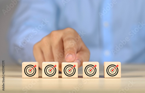 Wooden block showing success in communicating strategy, business goal plan, online, media, goals, business concept, technology