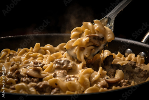 A Close-Up of a Wooden Spoon Scooping a Generous Serving of Beef Stroganoff from a Pan  with Steam and the Aroma of the Dish Wafting in the Air