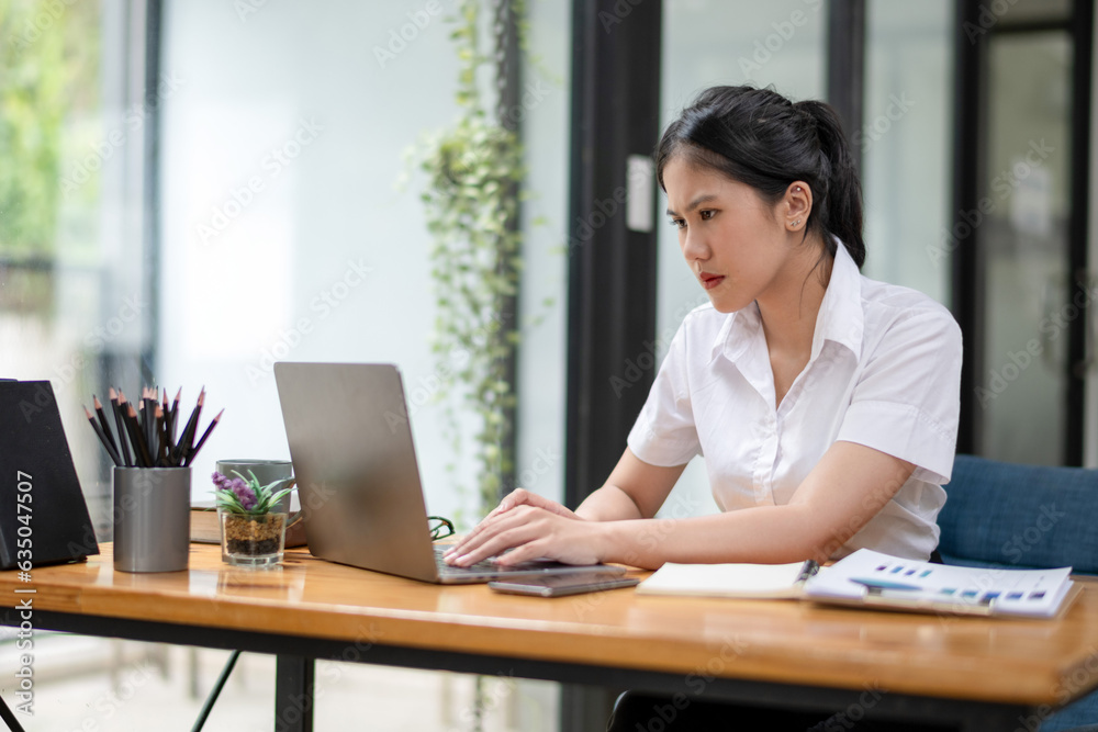 Stressed businesswoman working from laptop, project documentation error, Notify news of damage by email Stressed businesswoman working from laptop, project documentation error, Notify news of damage by email