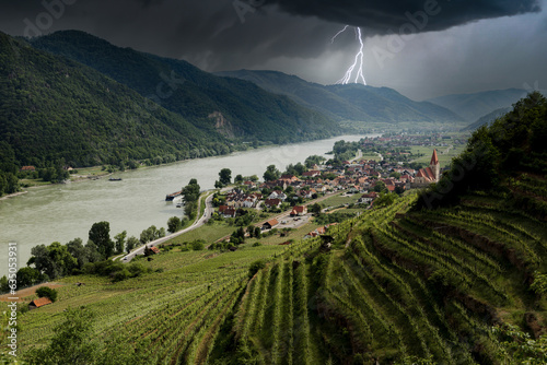 Thunderstorm with lightning over Weissenkirchen village. Wachau, Austria.