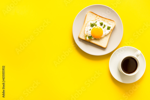 Fried eggs on toast bread with coffee - fast breakfast background