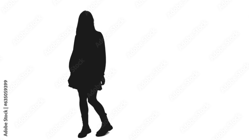 Black and white silhouette of young adult girl in short dress and boots ...