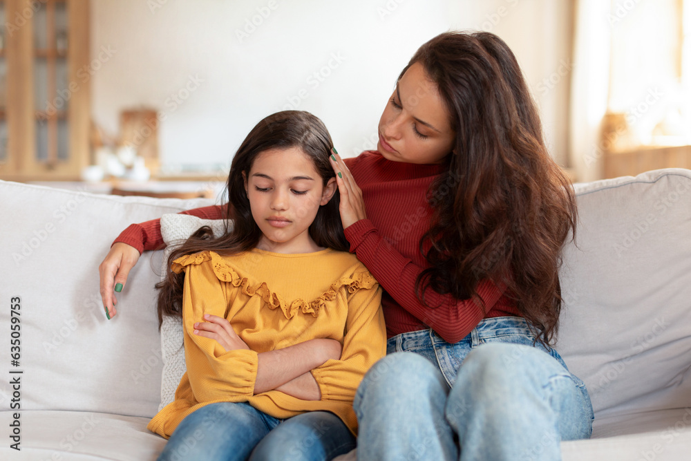 Arabic Mom Talking To Unhappy Daughter Supporting Her At Home Arabic Mom Talking To Unhappy Daughter Supporting Her At Home