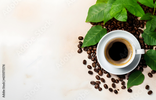 Top-View Coffee Delight Cup of Black Coffee, Green Leaves, and Beans on a Light Background