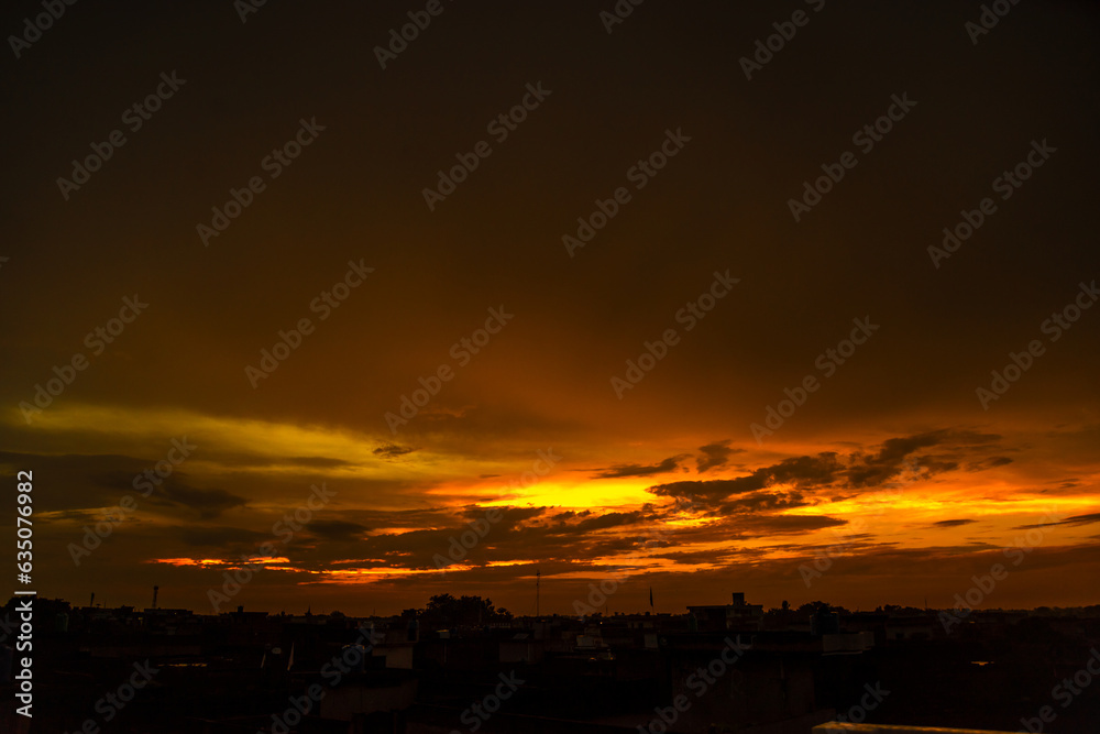 Beautiful sunset over the city with a cloudy sky Beautiful sunset over the city with a cloudy sky