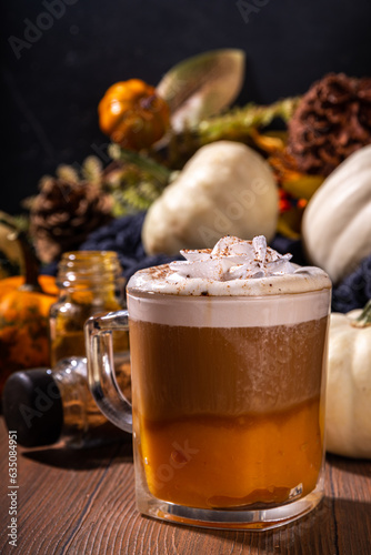 Pumpkin spice latte in a glass mug