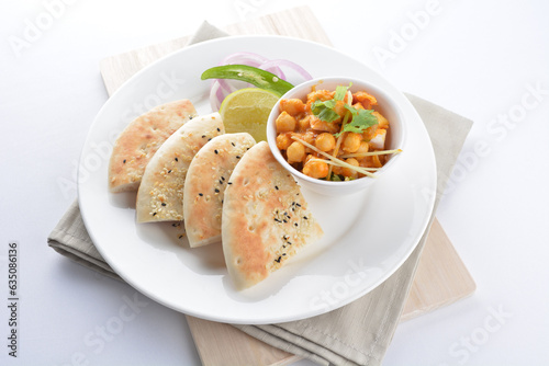 Indian vegetable bean curry sauce with baked naan pizza toast bread kebab breakfast on white background asian chef appetiser halal bakery food restaurant pastry menu for cafe