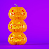 Halloween purple background with Jack o lanterns and copy space.