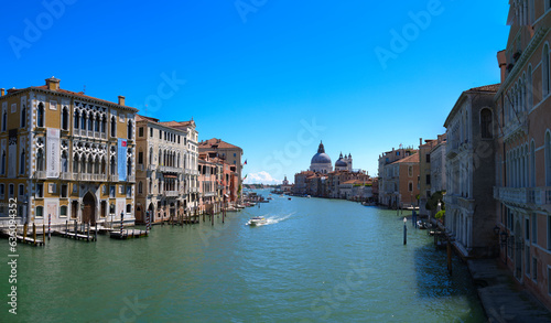 Wide angle scenic view over Grand Canal at the old town of Venice seen from Accademia Bridge on a sunny summer day. Photo taken August 7th, 2023, Venice, Italy. © Michael Derrer Fuchs