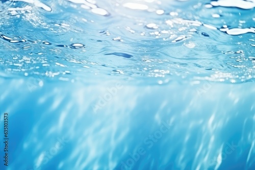 De-focused blurred transparent blue colored clear water