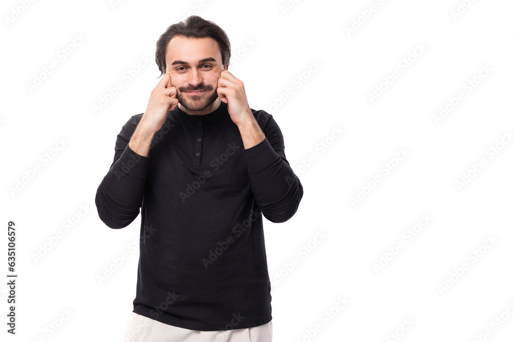 young handsome brunet european man in black sweatshirt with mockup on isolated white background young handsome brunet european man in black sweatshirt with mockup on isolated white background