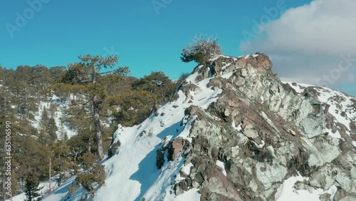 Drone flight over the snowy mountains of Troodos