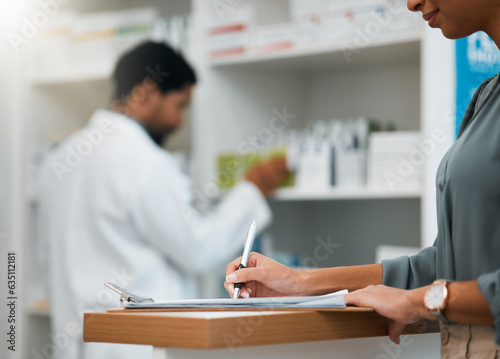 Woman at pharmacy, clipboard and medical insurance information at counter for script for prescription medicine. Paperwork, writing and patient at pharmacist with application for pharmaceutical drugs.