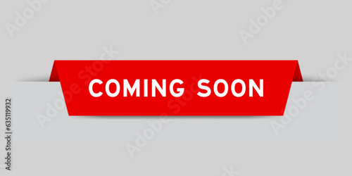 Red color inserted label with word coming soon on gray background