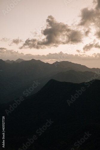 View of mountains from the top of Pico das Agulhas Negras in Itamonte MG. Beautiful landscape with mountains and sun rays.  © mariana