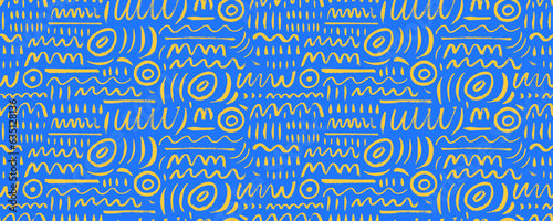 Various doodle lines seamless pattern in blue and yellow colors. Childish style creative art background. Squiggles, circles, dots and daubs. Simple childish scribble wallpaper texture.