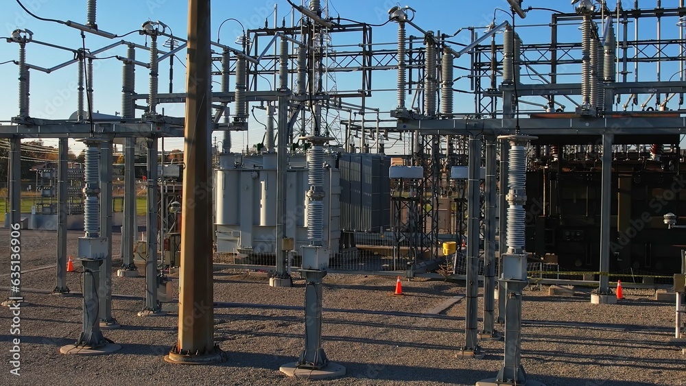 Electrical substation or electric grid of high voltage power lines and wires. Energy transmission and distribution to the city and households. Concept of electricity and infrastructure development.