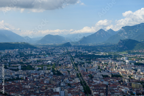 View on central part of Grenoble city from Bastille fortres witn mountains around, old cable car, Isere, France © barmalini