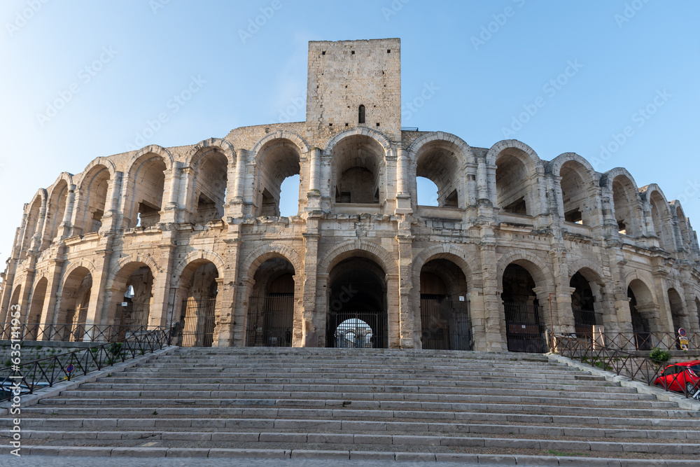 View on old Roman Arena in ancient french town Arles, touristic destination with Roman ruines, Bouches-du-Rhone, France