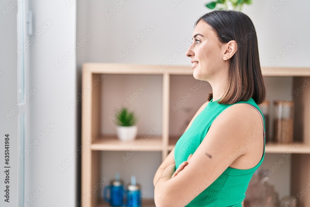 Young hispanic woman smiling confident standing with arms crossed gesture at home Young hispanic woman smiling confident standing with arms crossed gesture at home