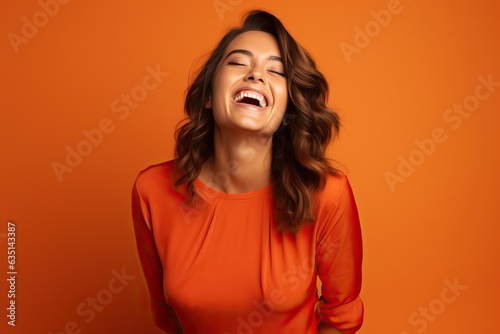 Laughing Young Brunette Woman in Red Blouse