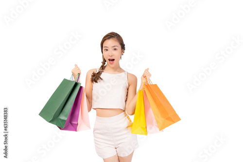 Portrait excited beautiful woman hold shopping bags isolated on white background and copy space Surprise happy asian young lady open mouth with excited Beauty young cheerful female love shopping