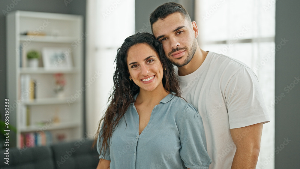 Man and woman couple standing together smiling at home Man and woman couple standing together smiling at home