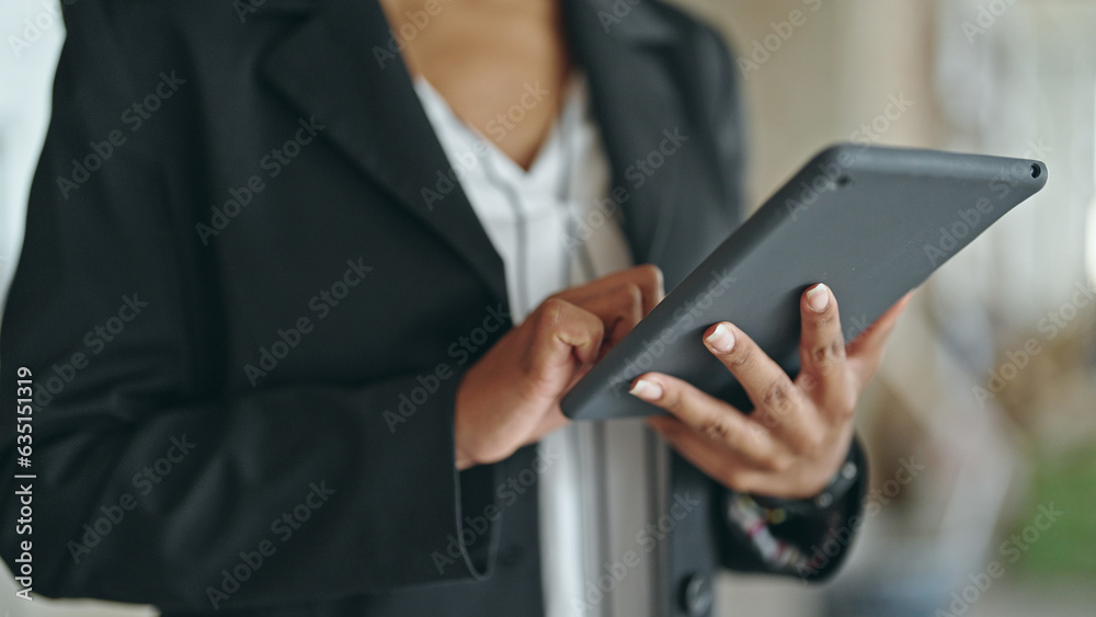 African american woman architect using touchpad at construction site African american woman architect using touchpad at construction site